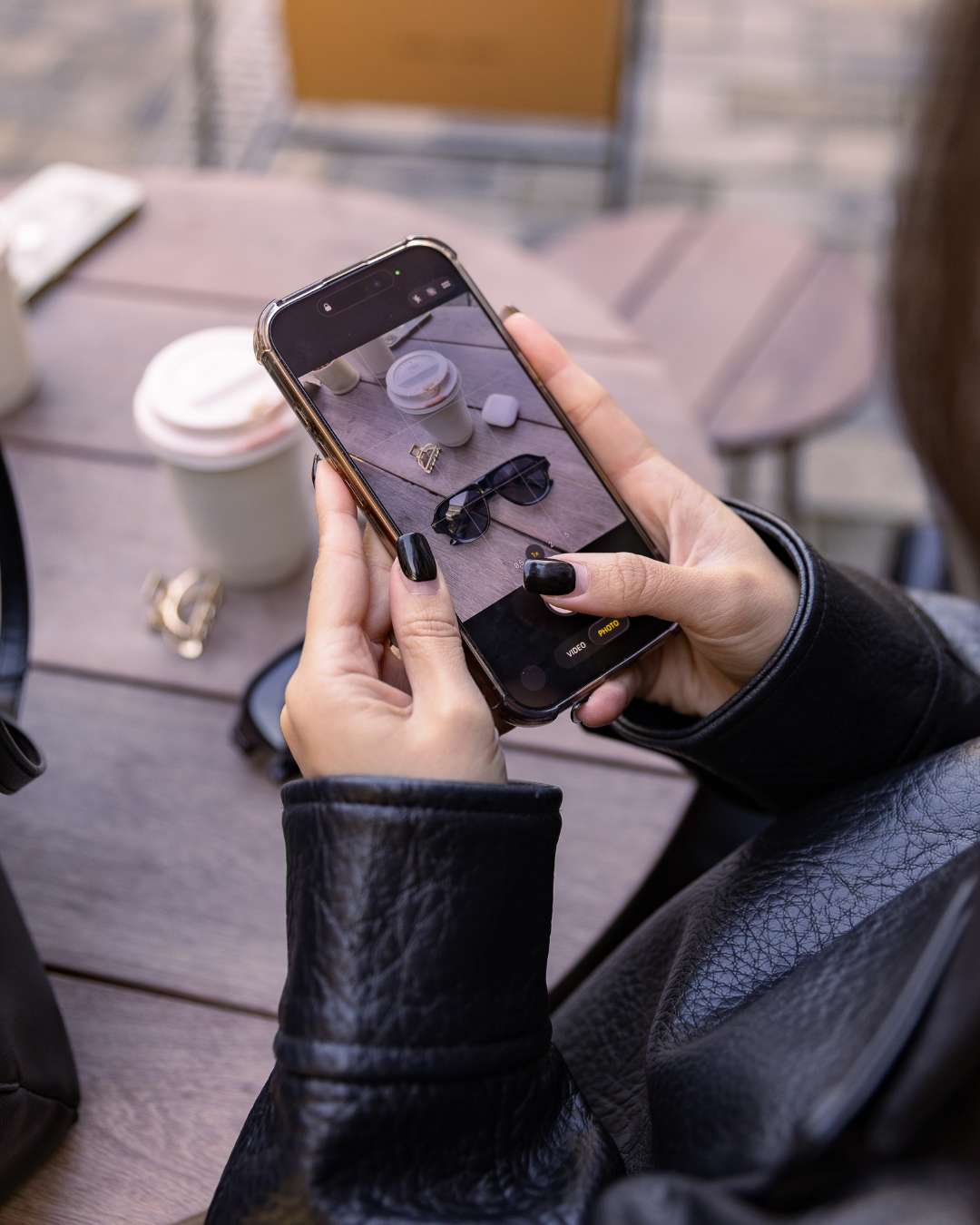 smartphone displaying polarised aviator sunglasses with black acetate frames