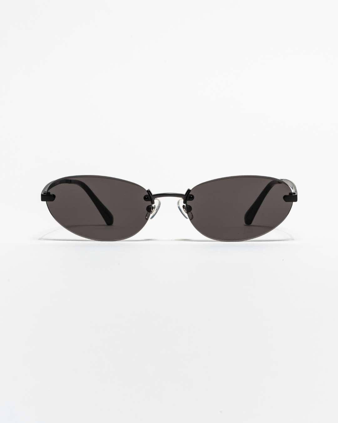 rimless oval sunglasses with black lenses