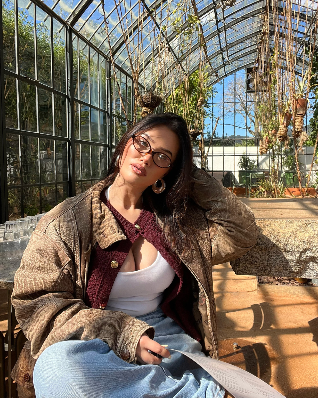 woman wearing oval glasses with tortoiseshell acetate frames