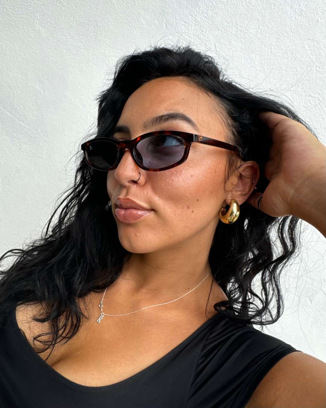 woman wearing rectangular polarised sunglasses with blue lenses