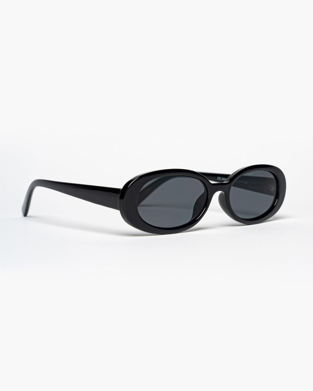side view of slim oval sunglasses with black frames and lenses