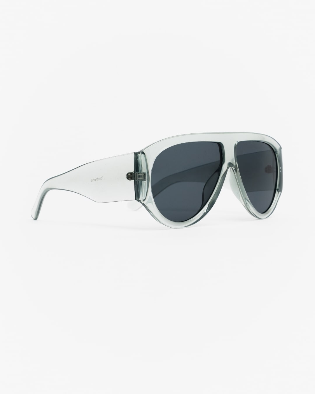 side view of oversized shield sunglasses with transparent seafoam frames