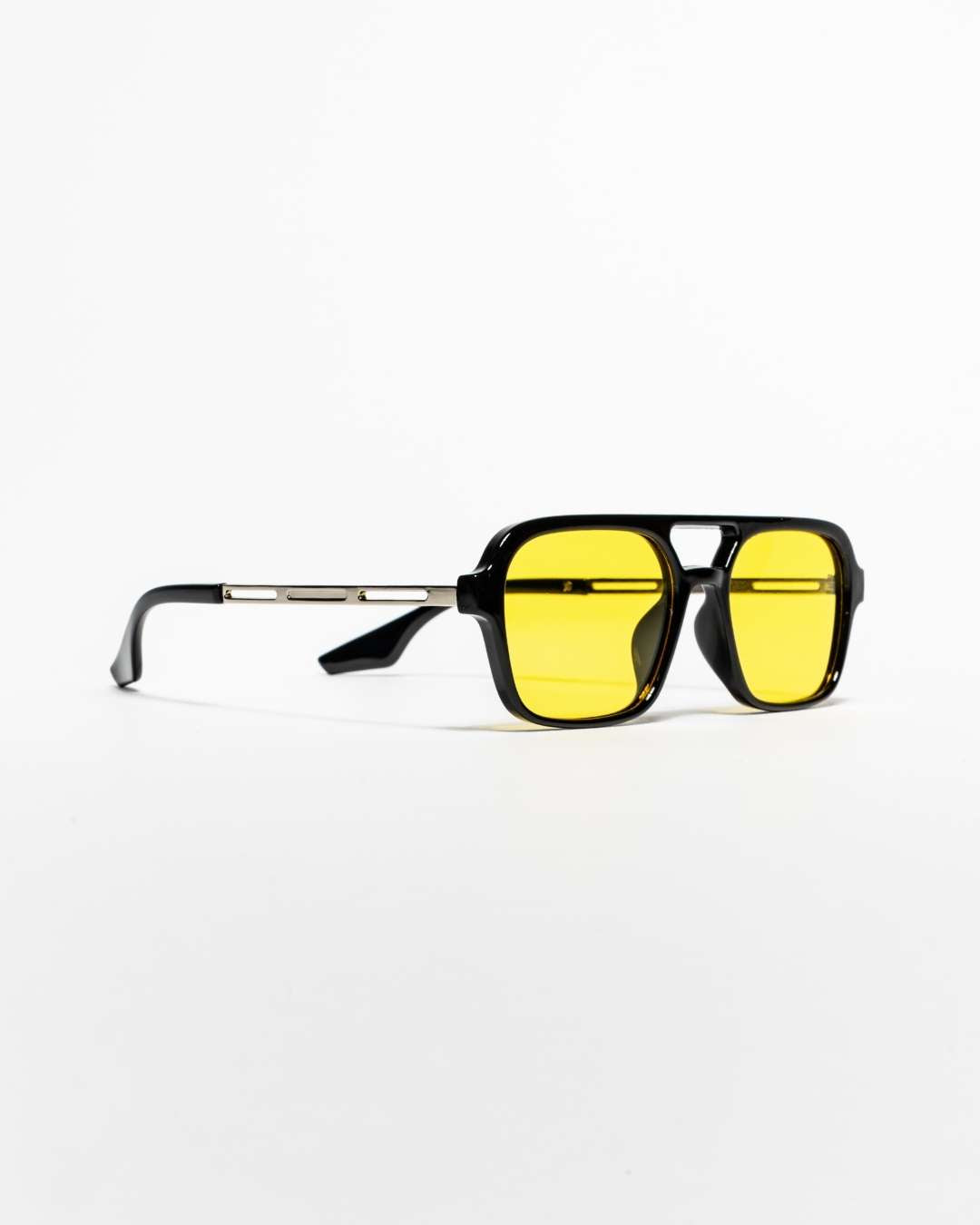 side view of aviator sunglasses with black frames and polarised yellow-tinted lenses