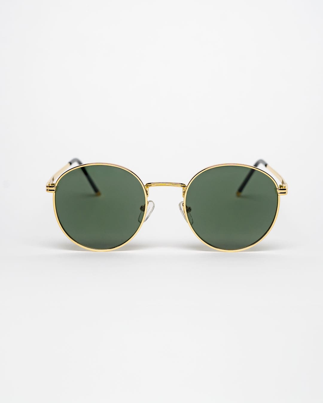 round sunglasses with a gold metal frame and polarised forest green lenses