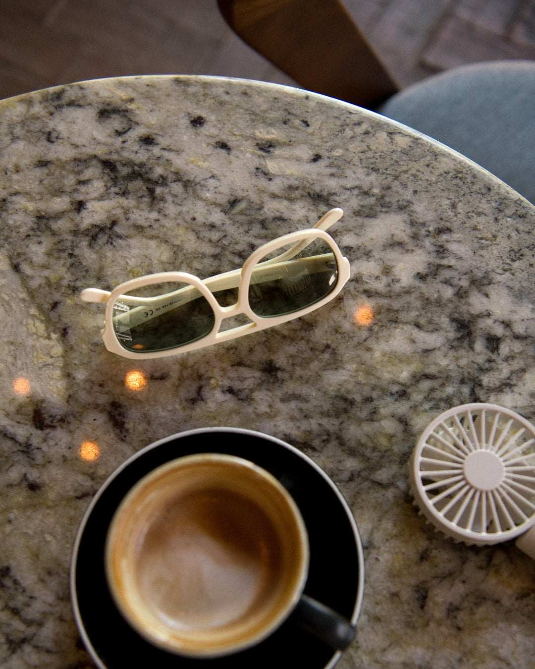 mistletoe rectangular aviator acetate sunglasses on a stone table