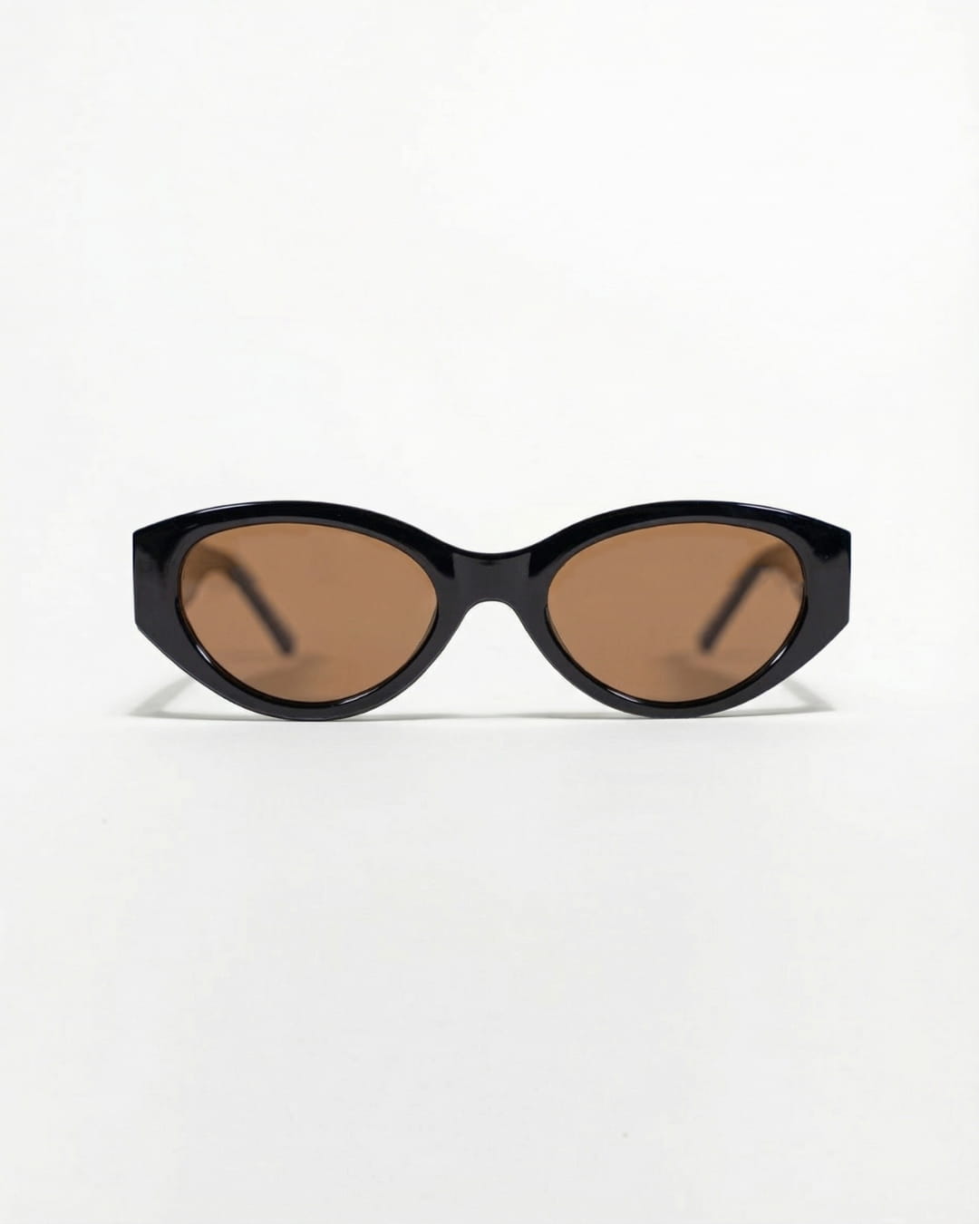 oval polarised sunglasses with black frames and brown lenses