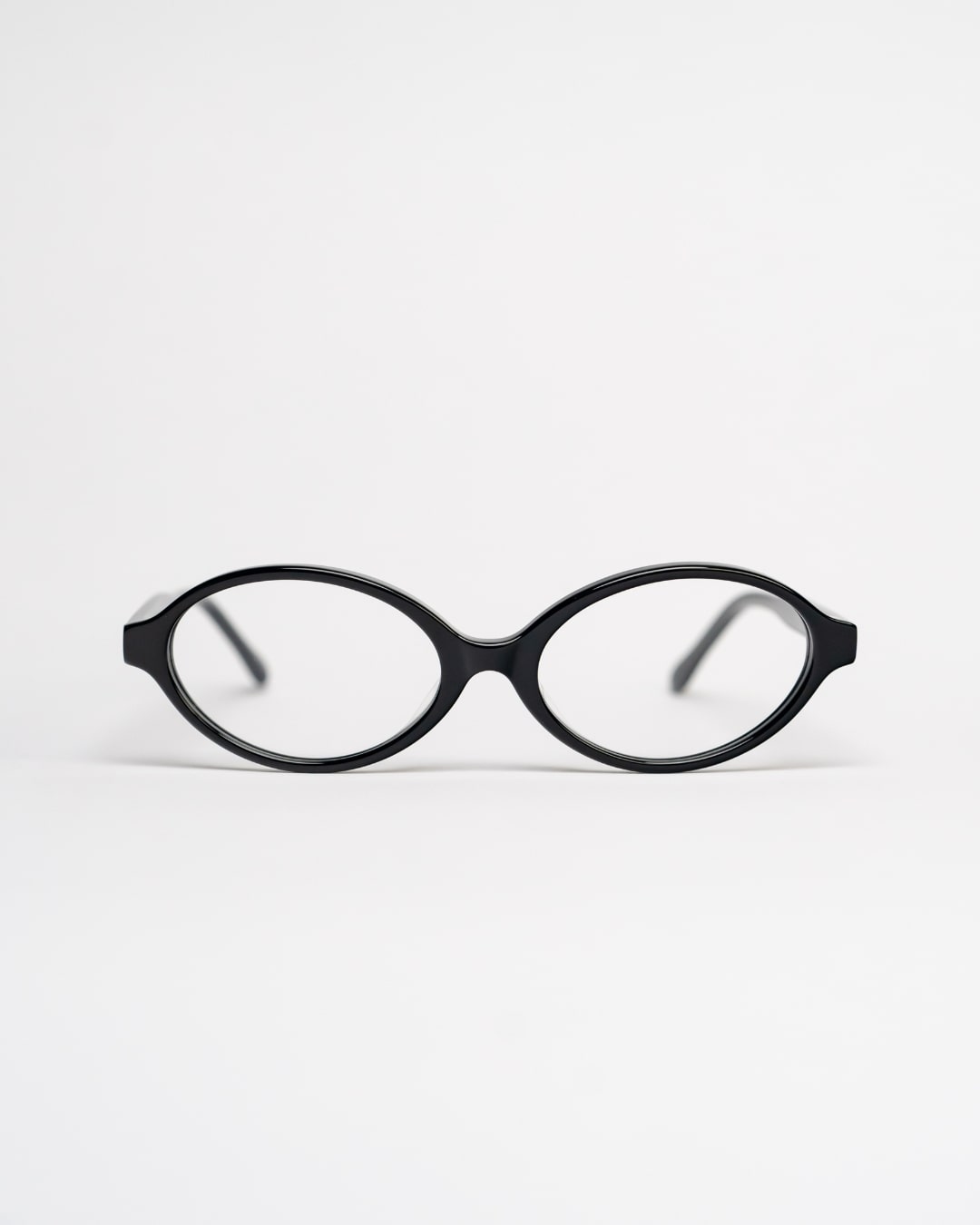oval glasses with black acetate frames