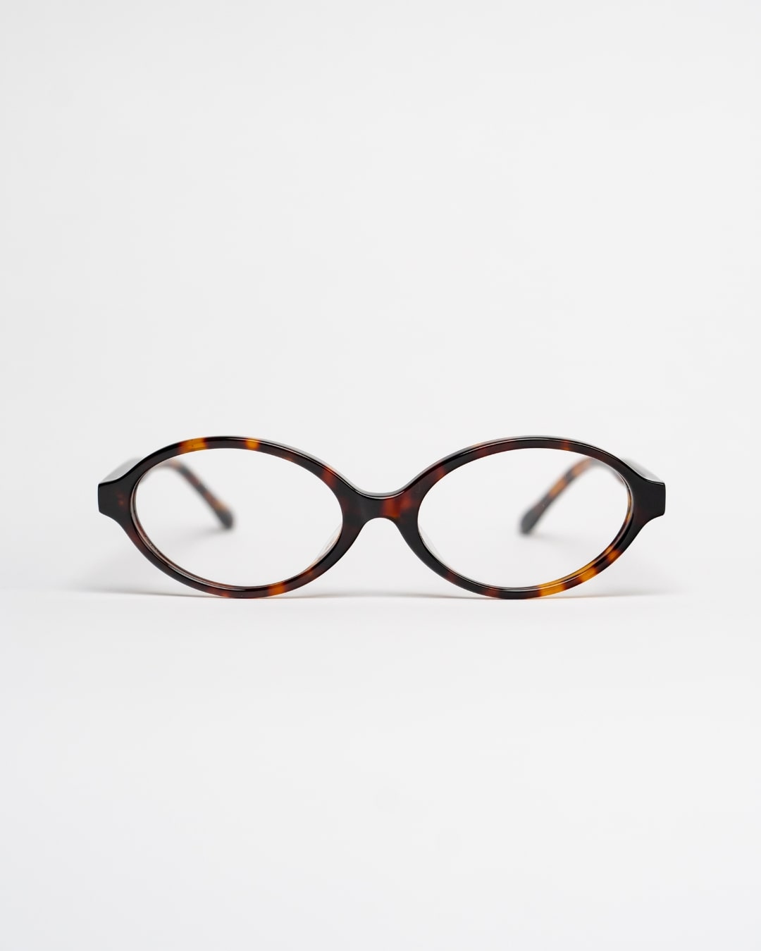 oval glasses with tortoiseshell acetate frames